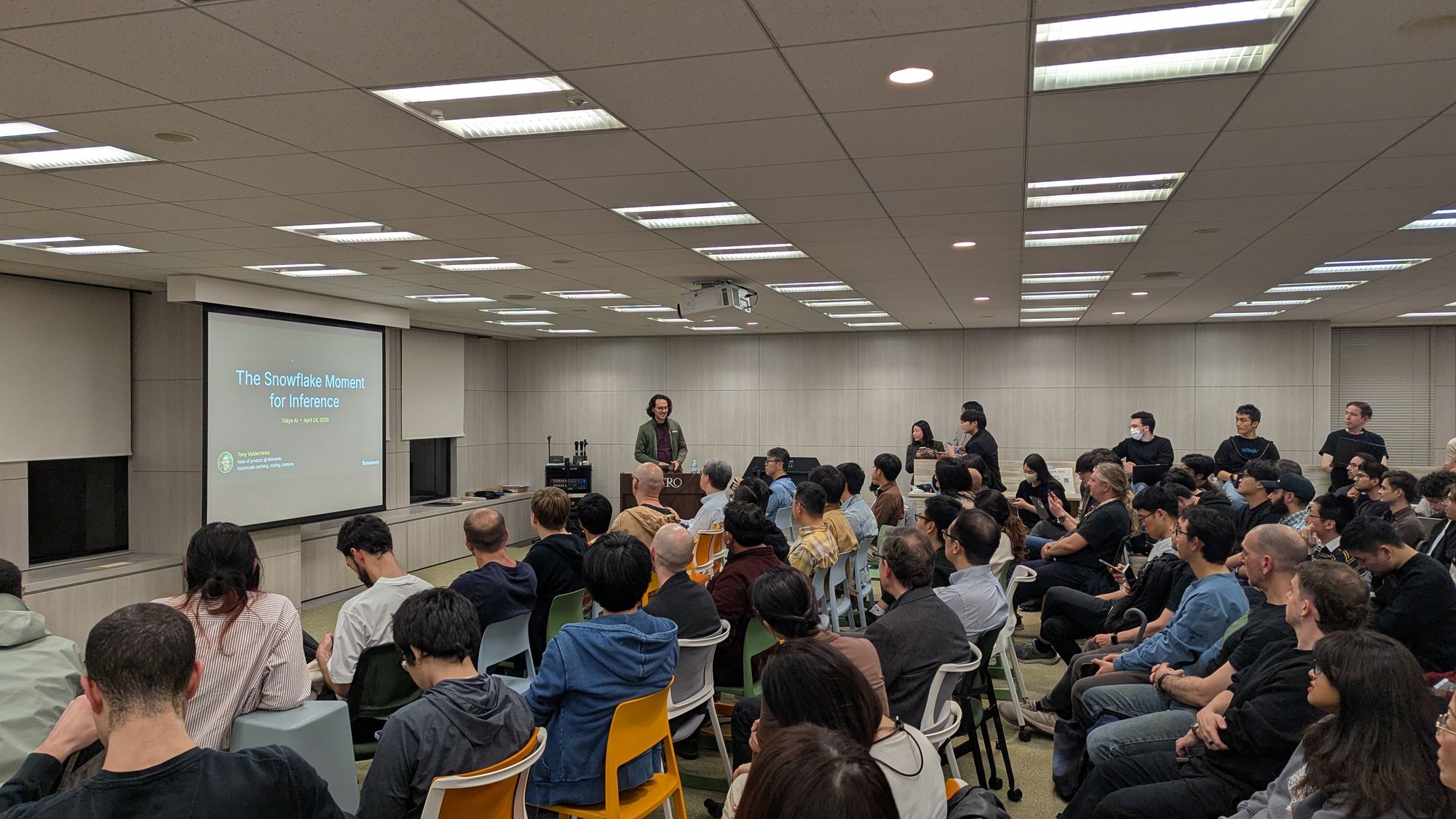 Speaker presentation and audience at A vLLM Deep Dive - Distributed Inference, KV Cache Evolution, and Model Compression.