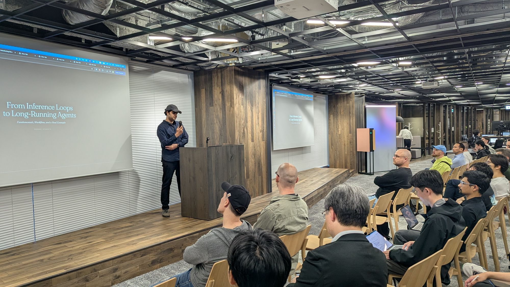 Speaker presentation and audience at Engineering Agentic Workflows - A Full-Stack Perspective.