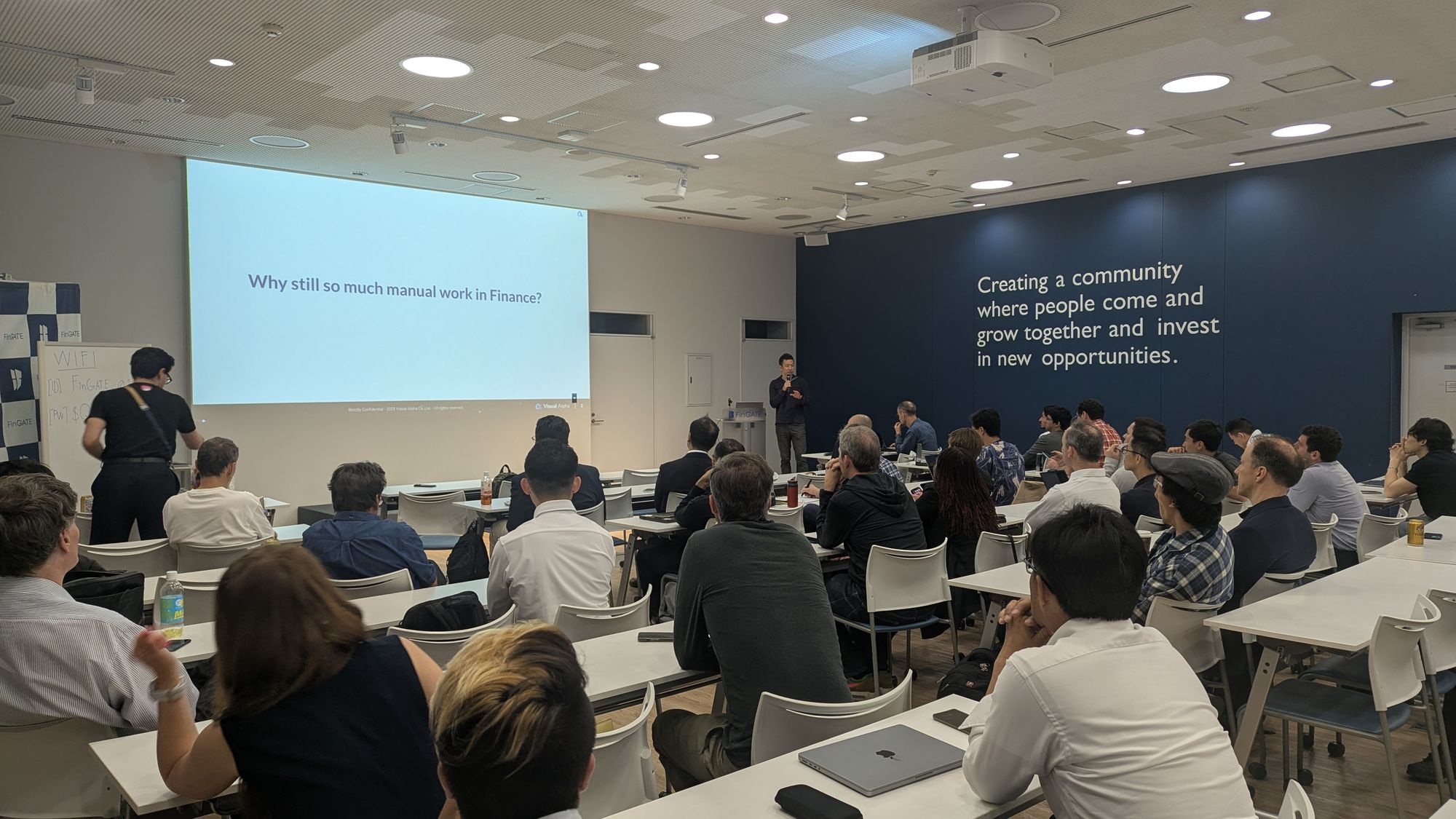 Speaker presentation and audience at AI in Financial Services - From LLM Failure Modes to Graph-Based Fraud Detection.