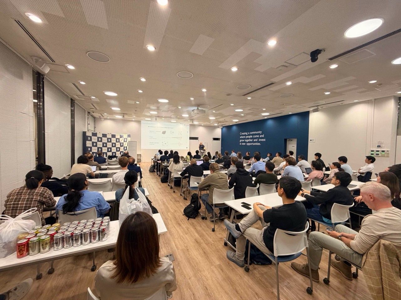 Speaker and audience at the Tokyo AI AI x Finance event.
